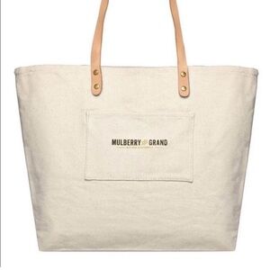 Mulberry Grand Accessories canvas tote bag with leather handles.